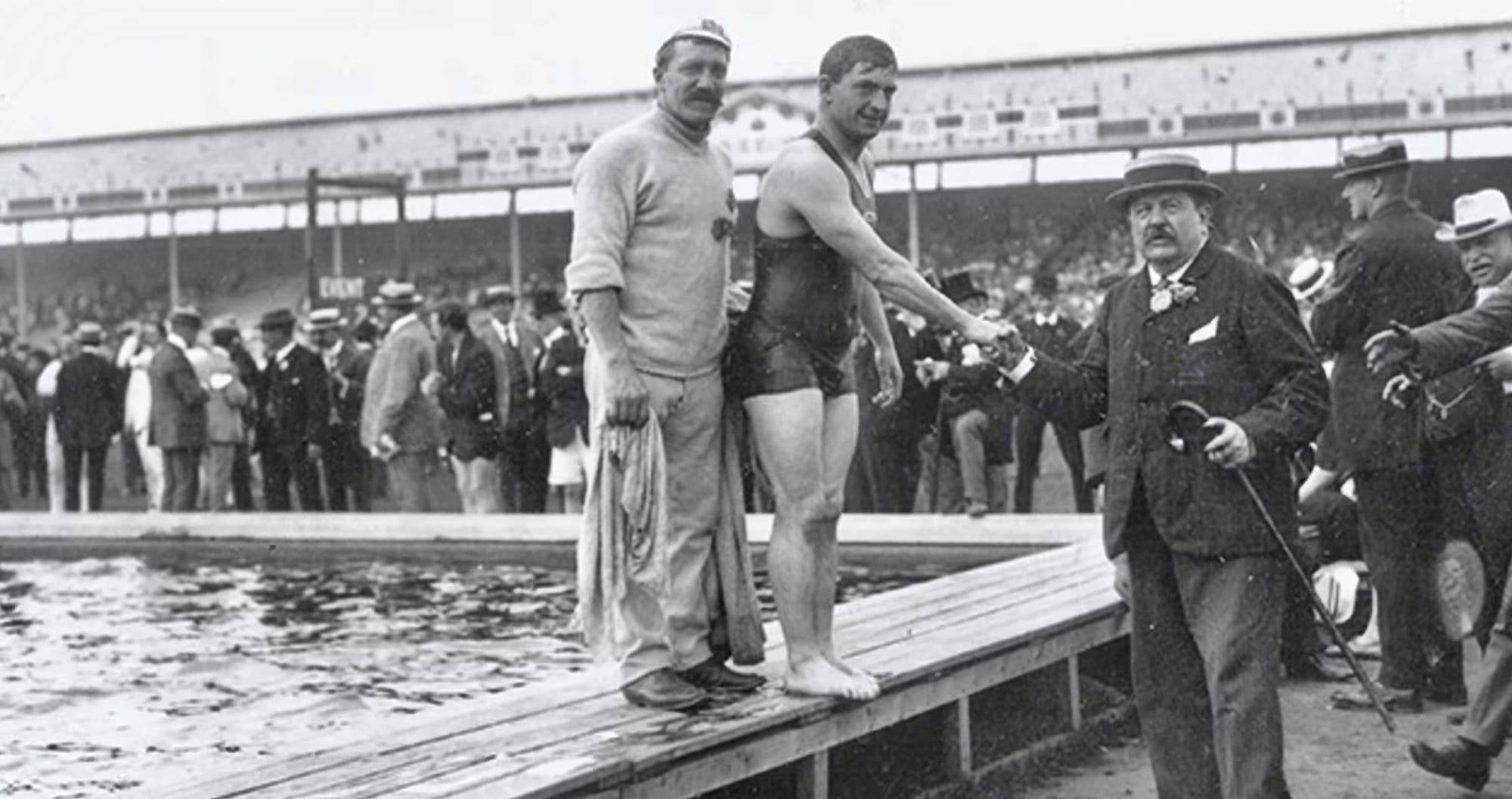 When Over 60,000 On Each Of 11 Days Flocked To See Olympic Swimming & Taylor’s Triple Gold At White City In 1908