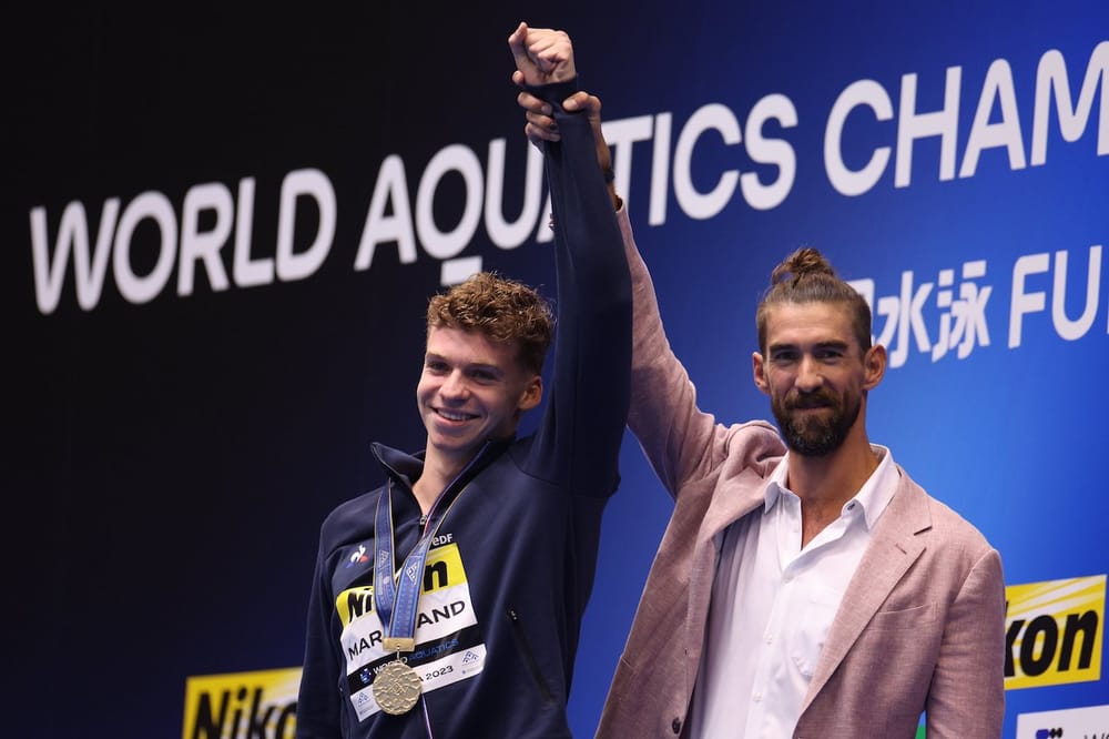 Léon Marchand Heralded By Michael Phelps After Magnificent 4:02.50 Takes GOAT's Last World Record post image