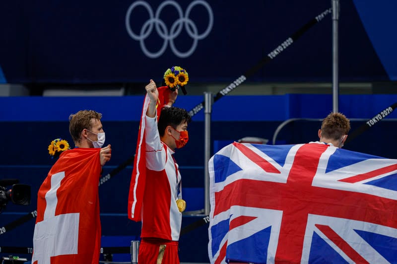 Two Swimmers, A Couple Of Burgers & A Big Belly Ache For Clean Sport post image